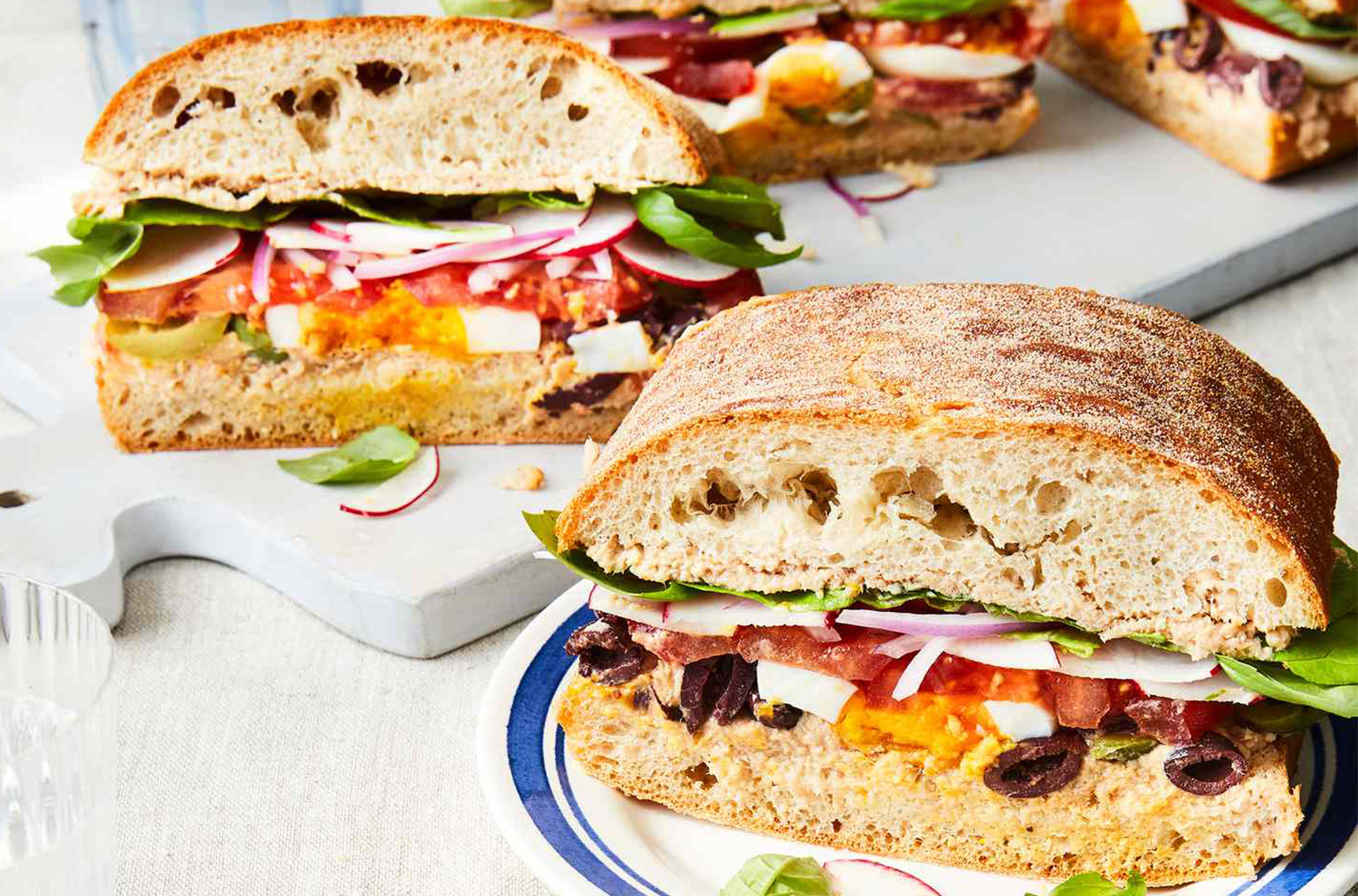 Pan Bagnat sandwich sliced on a plate